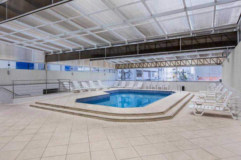 a large swimming pool in a large room 